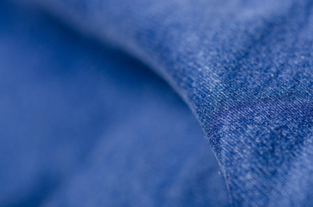 Blue jeans fabric macro texture fashion on blur background