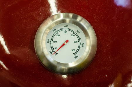 thermometer barbecue white on a red backgroundの写真素材