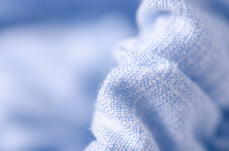 Blue fabric linen clothing seams rubber band on blur backgroundの写真素材