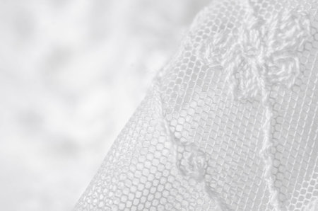White fabric clothing lace flowers dress wedding textile on blur background