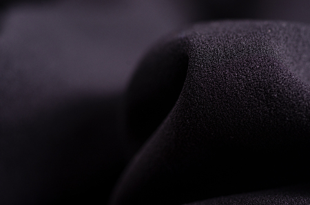 Black fabric material texture macro blur backgroundの写真素材