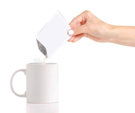 The cup powder medicine cold flu in hand on white background isolationの写真素材