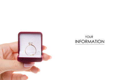 Gold ring in a box in a female hand pattern on a white background isolationの写真素材