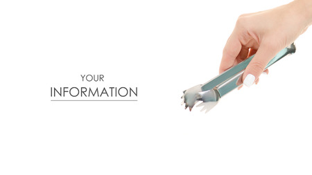 Female hands with kitchen tongs pattern on white background isolationの写真素材