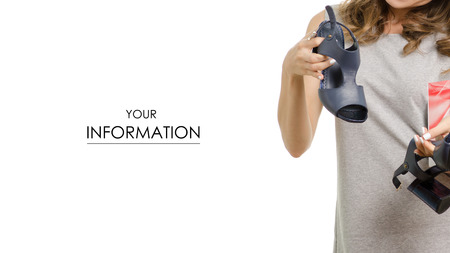 Beautiful young woman with a box of new shoes pattern on a white background isolatedの写真素材