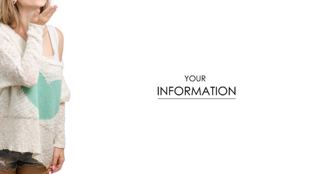 Beautiful young woman in a sweater with a heart kiss pattern on a white background isolationの写真素材