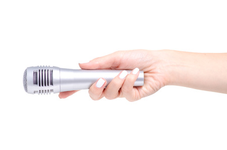 Microphone in hand on white background isolationの写真素材