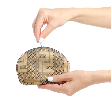 Cosmetic bag beautician in hand isolated on a white background.の写真素材