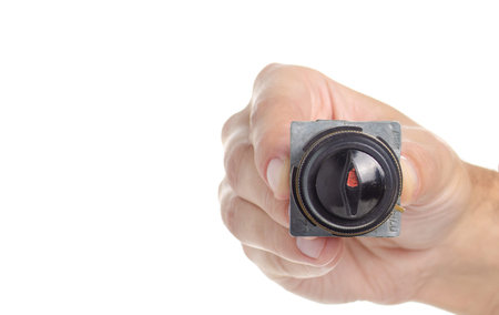 Rotary switchin a hand on a white background isolation