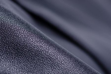 Black leather fabric textile material texture macro blur background