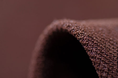 Brown fabric velveteen textile material texture macro blur backgroundの写真素材