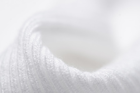 White sweater fabric textile material texture macro blur backgroundの写真素材