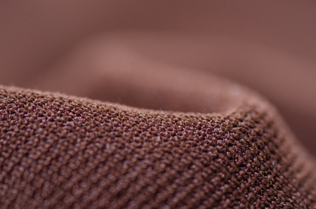 Brown fabric velveteen textile material texture macro blur backgroundの写真素材
