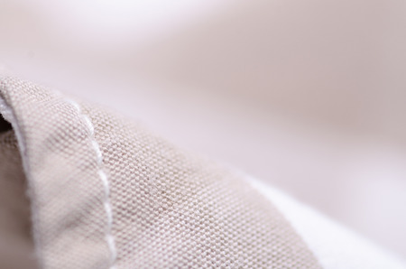 Beige cage fabric textile material texture macro blur backgroundの写真素材