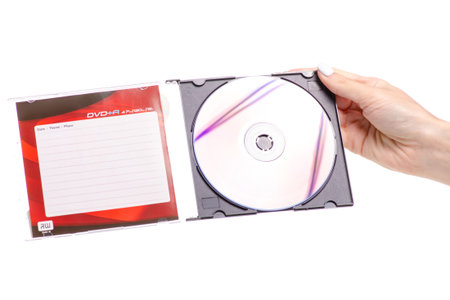 Disc in box in hand on white background. Isolation.