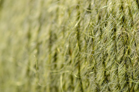 Green wool thread macro texture material blur background