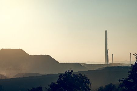 evening landscape of metallurgical plant with high pipesの写真素材