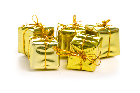 Christmas toys golden gifts box isolated on a white background.の写真素材
