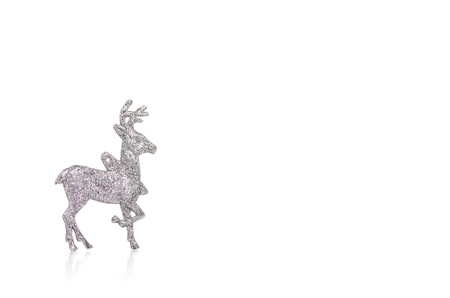 Christmas toy silver deer isolated on a white background.の写真素材