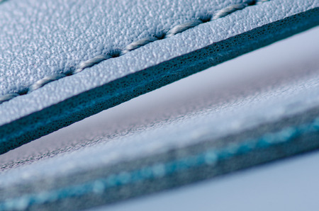 Blue leather material texture bag macro on blur backgroundの写真素材