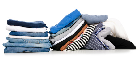 A pile stack of clothes isolated on a white background.の写真素材