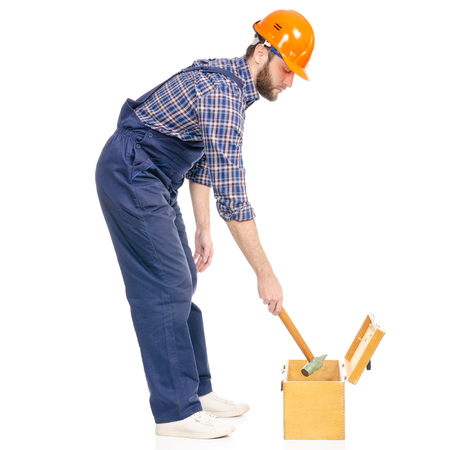 Young man builder with toolbox hammer industry worker hardhat isolated on white background.の写真素材