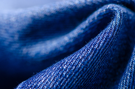 Blue jeans material fabric texture fashion seam fittings macro blur backgroundの写真素材