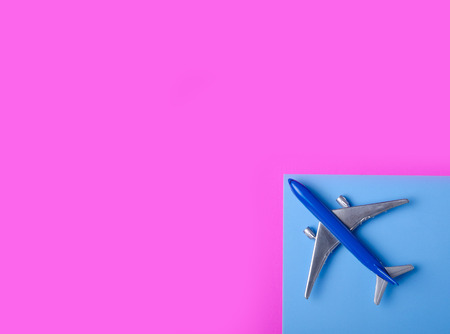 Blue model plane,airplane on color pink blue background, top viewの写真素材