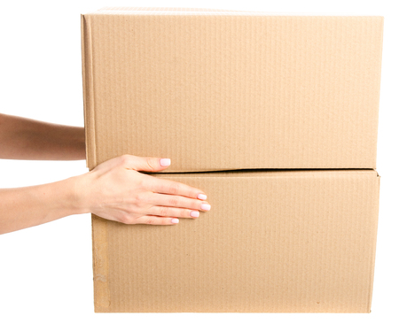 Boxes delivery in hand isolated on a white background.の写真素材