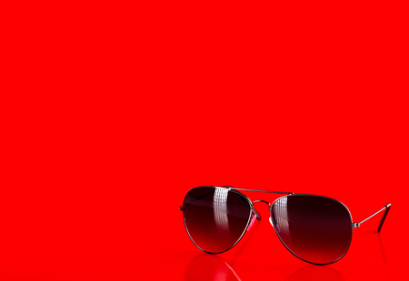 Sunglasses fashion summer accessory on red backgroundの写真素材