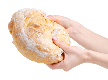 Round bread in hand on a white background. Isolationの写真素材