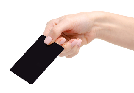 Black plastic card in hand isolated on a white background.の写真素材