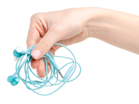The headphones in hand isolated on a white background.の写真素材