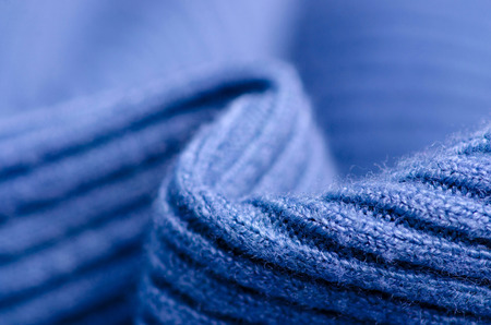 Fabric warm blue sweater textile material texture blur background macroの写真素材