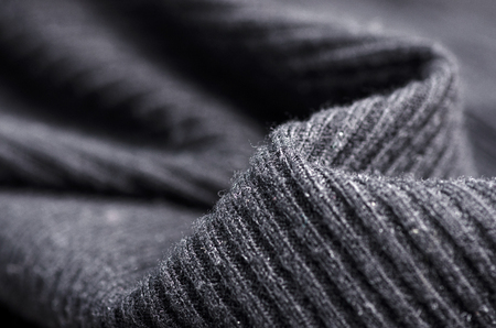 Fabric warm black sweater textile material texture blur background macroの写真素材