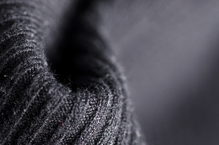 Fabric warm black sweater textile material texture blur background macroの写真素材