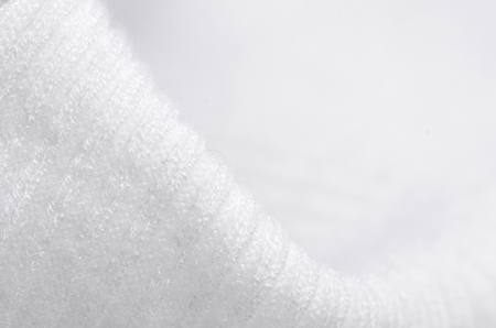 Fabric warm white sweater textile material texture blur background macroの写真素材