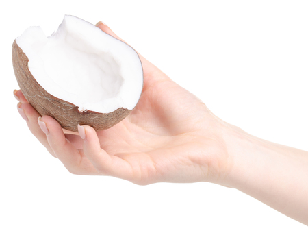 A piece of coconut in hand isolated on white backgroundの写真素材