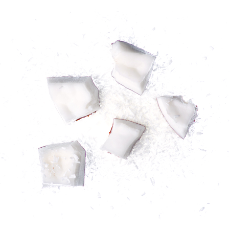 Coconut slice piece shavings isolated on white background, top viewの写真素材