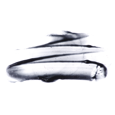 Black mask for face beauty care isolated on white background, top viewの写真素材