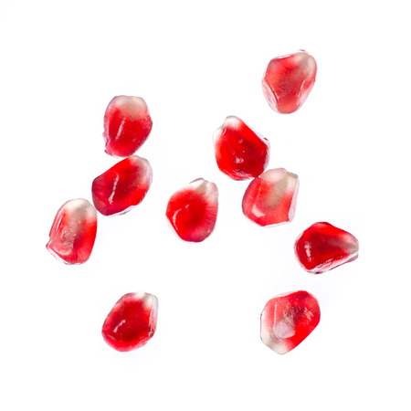 Pomegranate fruit macro isolated on white background, top viewの写真素材