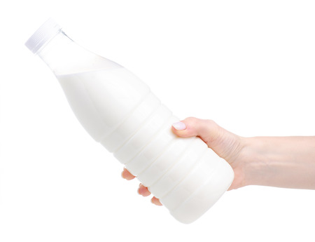 Plastic bottle milk in hand isolated on a white backgroundの写真素材