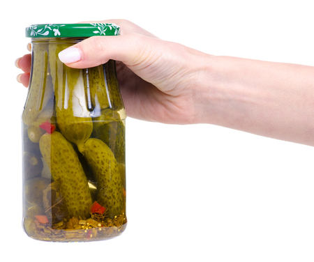 Jar of cucumbers in hand isolated on a white backgroundの写真素材