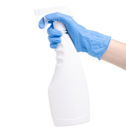 White cleaning spray with yellow rag in cleaning glove hand on white background isolationの写真素材
