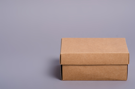 Box brown package minimalism on gray backgroundの写真素材