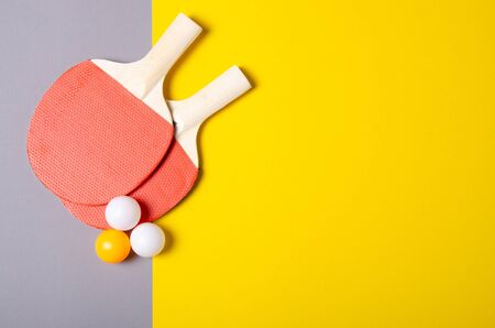 table tennis game on color gray yellow background, top viewの写真素材