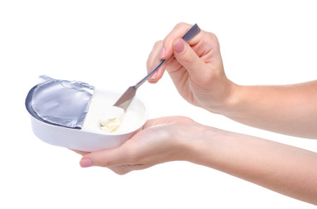 cream cheese processed in hand on white background isolation