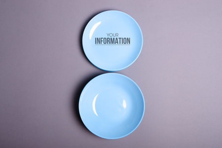 Blue empty plate on gray background