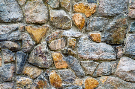 Fence of wild stone texture wall