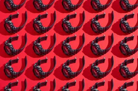 Black sport watch collage set pattern on red backgroundの写真素材